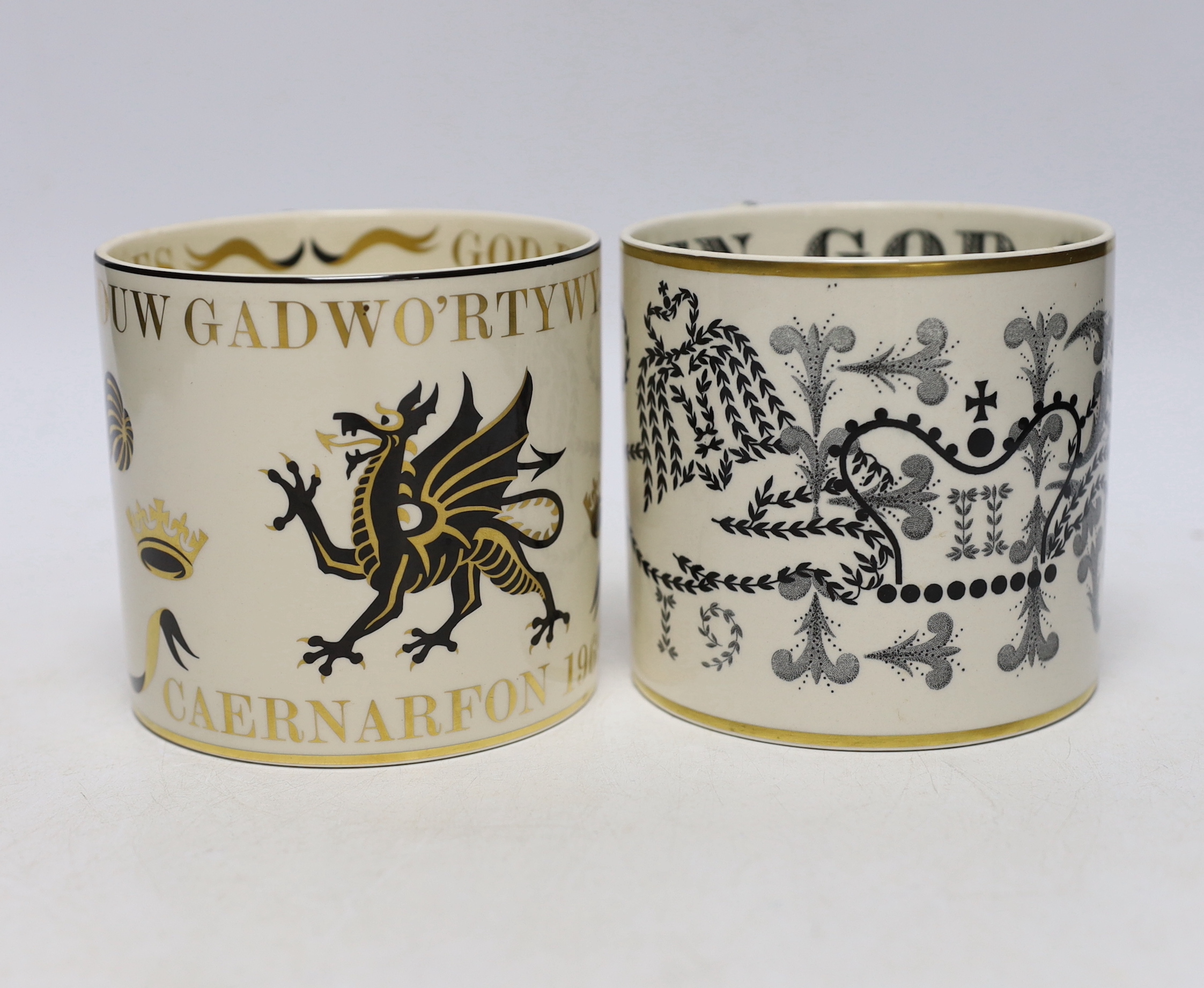 Two Wedgwood commemorative mugs by Guyatt; the Investiture of the Prince of Wales and the Coronation of Queen Elizabeth II